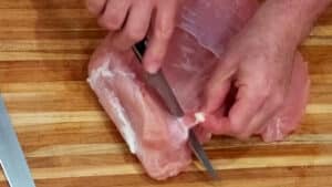 Stuffed Turkey Breast- Using a boning knife to remove the skin