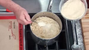 How to make Easy Arancini Recipe Adding Cheese to the hot rice