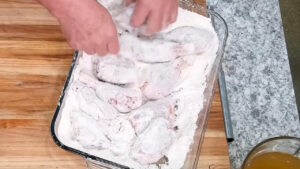 Easy Chicken and Rice Recipe - Dredge the chicken