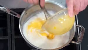 Easy Pastry Cream Filling Recipe - pour tempered egg mixture into milk