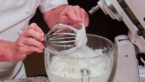 Easy Tiramisu Recipe - Whip egg whites until they form stiff peaks.