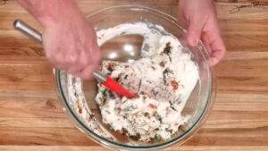 Manicotti Recipe - In a glass bowl, combine the ricotta