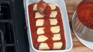 Manicotti Recipe - spread a layer of marinara sauce