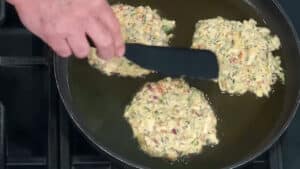 The Best Zucchini Pancake recipe - flatten with spatula