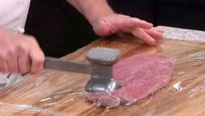 Pork Cordon Bleu Wrap in Plastic and Pound Flat