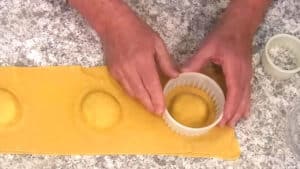 Cheese Raviolis with Spinach - Cutting out the raviolis